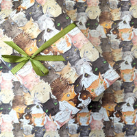 Gift box with cat pattern and green ribbon on a matching background